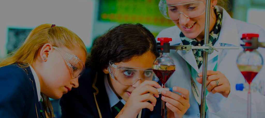 Photograph of students in Al Yasmina Academy Chemistry Labs carrying out experiments in distillation. Science is a core strength of this British curriculum school in Abu Dhabi.