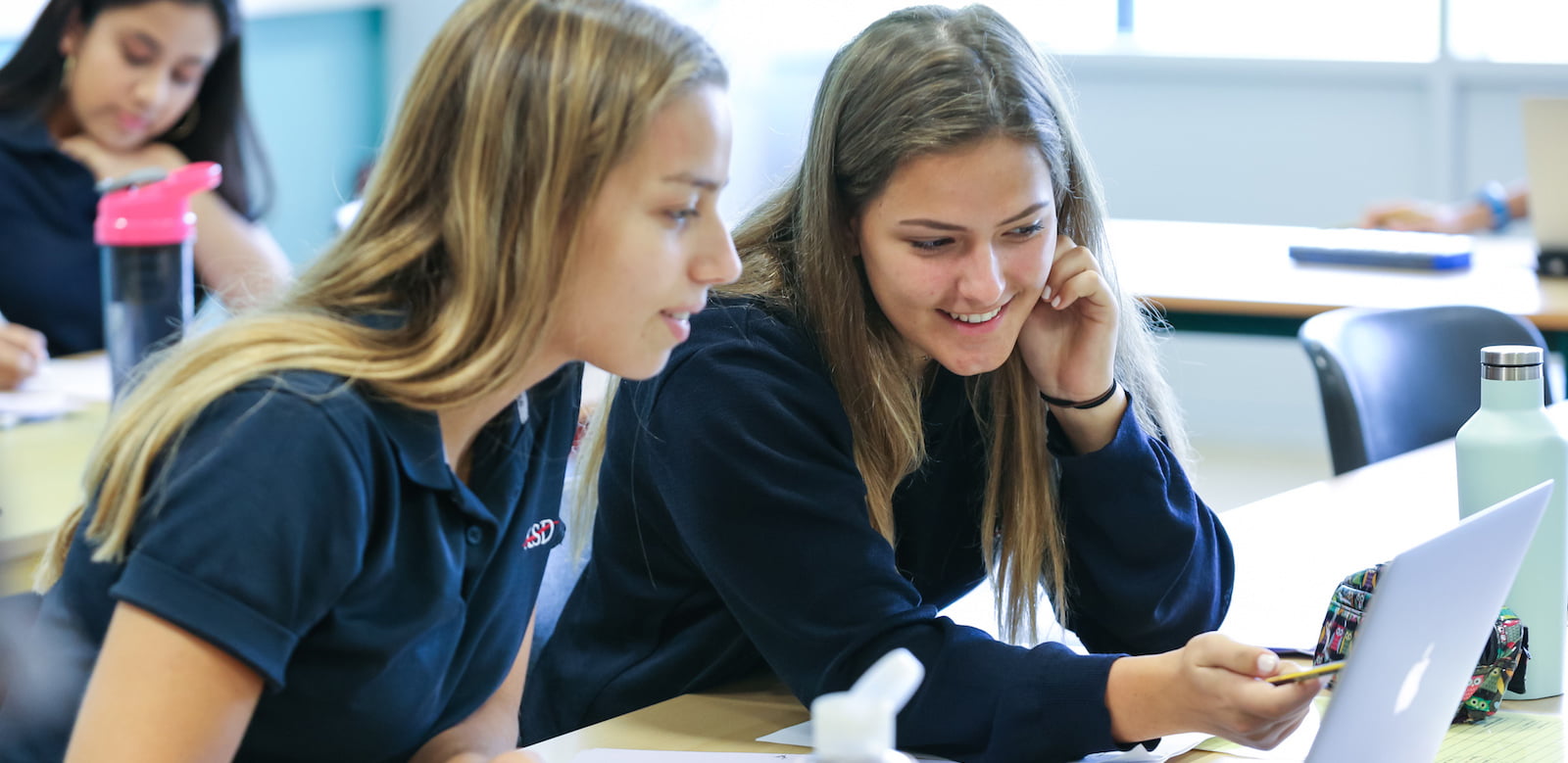 Image showing girls at the American School of Dubai talking through their homework