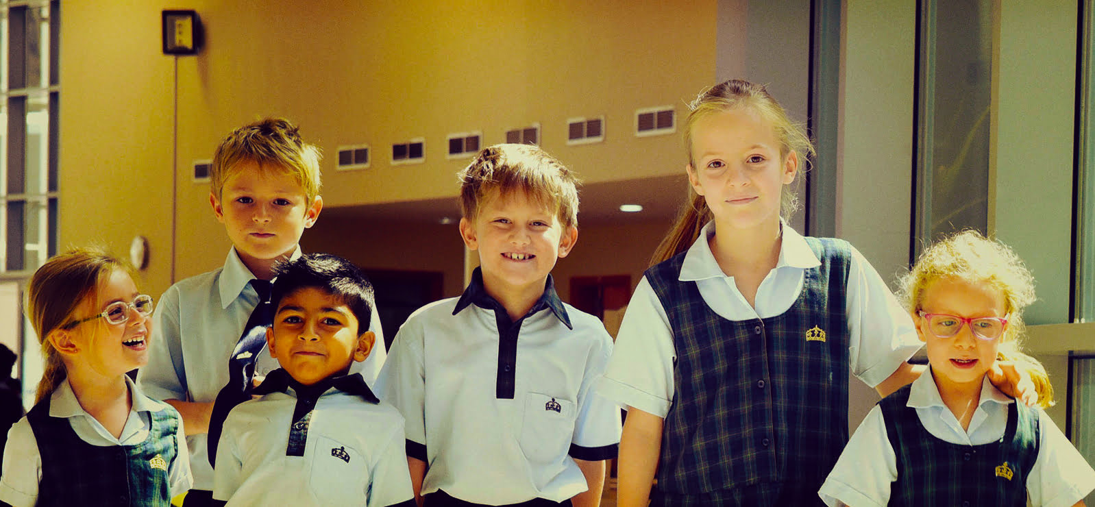 Photograph showing students from different grades in their school uniforms at Kings School Al Barsha - awarded one of the top 20 Best Schools in Dubai and Abu Dhabi by schoolscompared.com in 2017