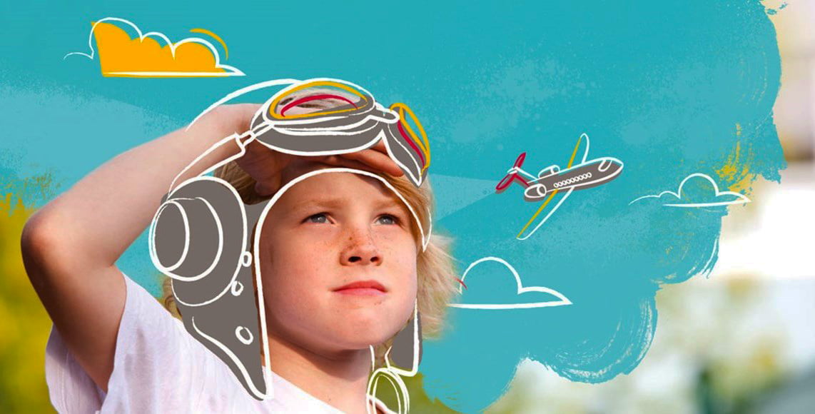 Photograph of a student at Nord Anglia's British International School Abu Dhabi imagining being a pilot used as part of the school's campaign to nurture ambition in its students - awarded one of the top 20 Best Schools in Dubai and Abu Dhabi by schoolscompared.com in 2017