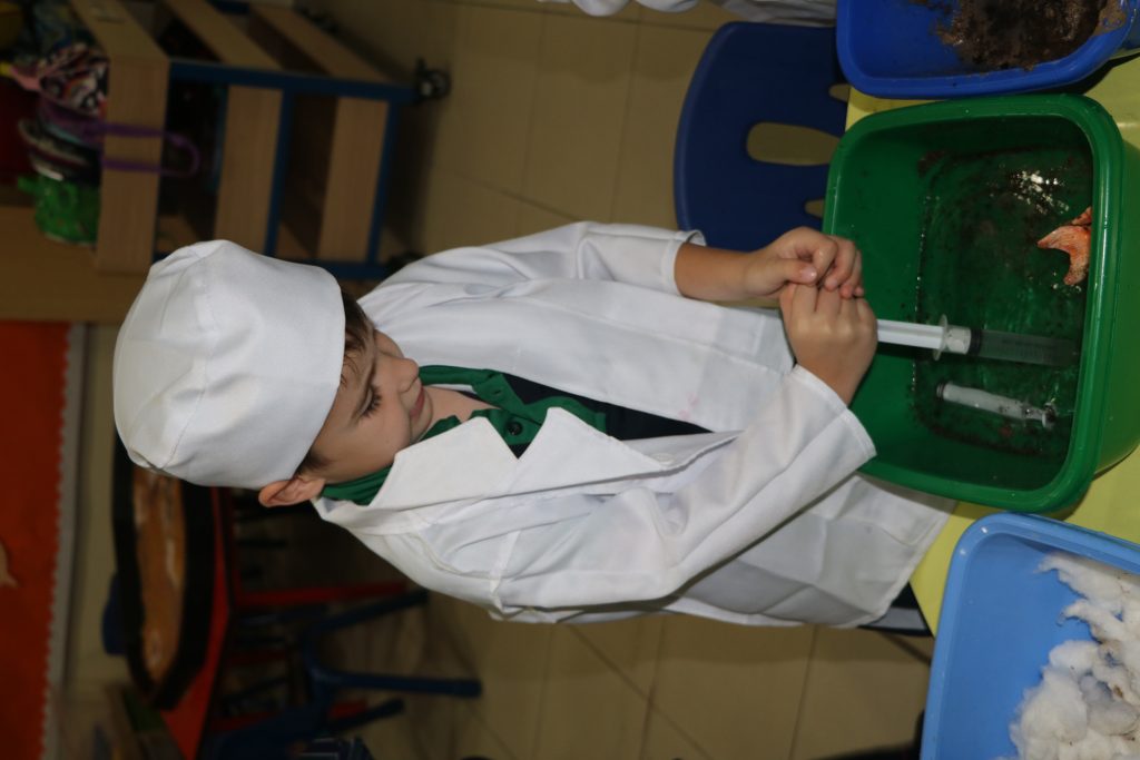 An FS student playing with school toys.