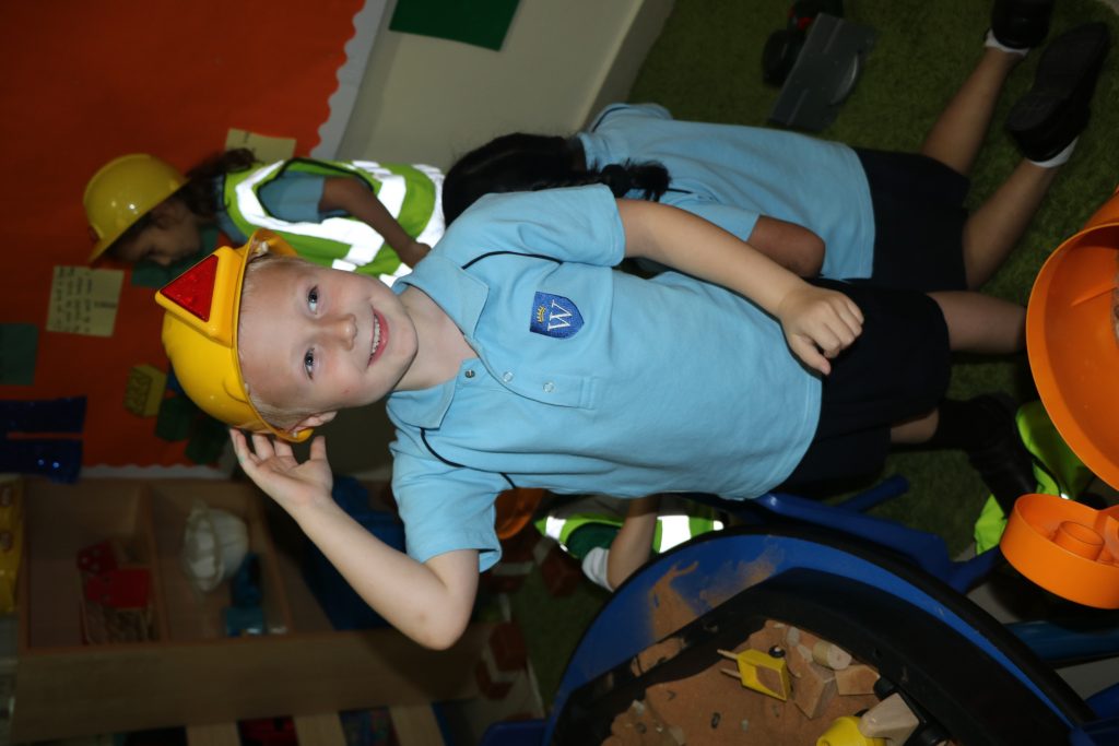 FS children live out their dreams using props and play doh. Who knew a fireman’s helmet could mean so much?