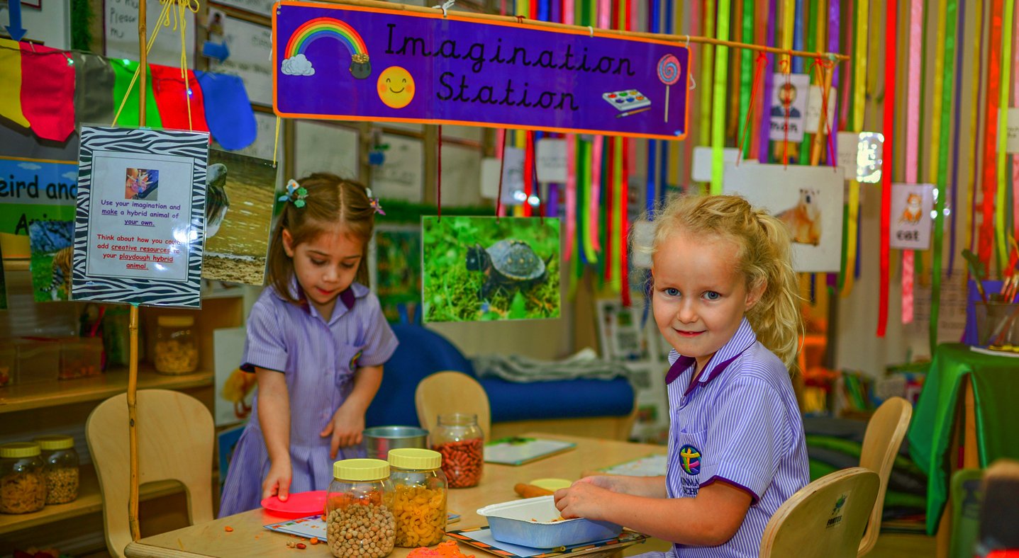 Photograph of children in a classroom surrounded by colour learning about the power of imagination