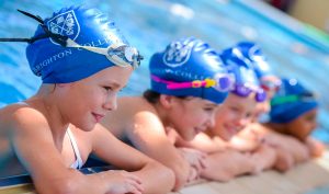 Fabulous facilities at Brighton College include those focused on Sport - here we see youn children resting in the swimming pool after competition