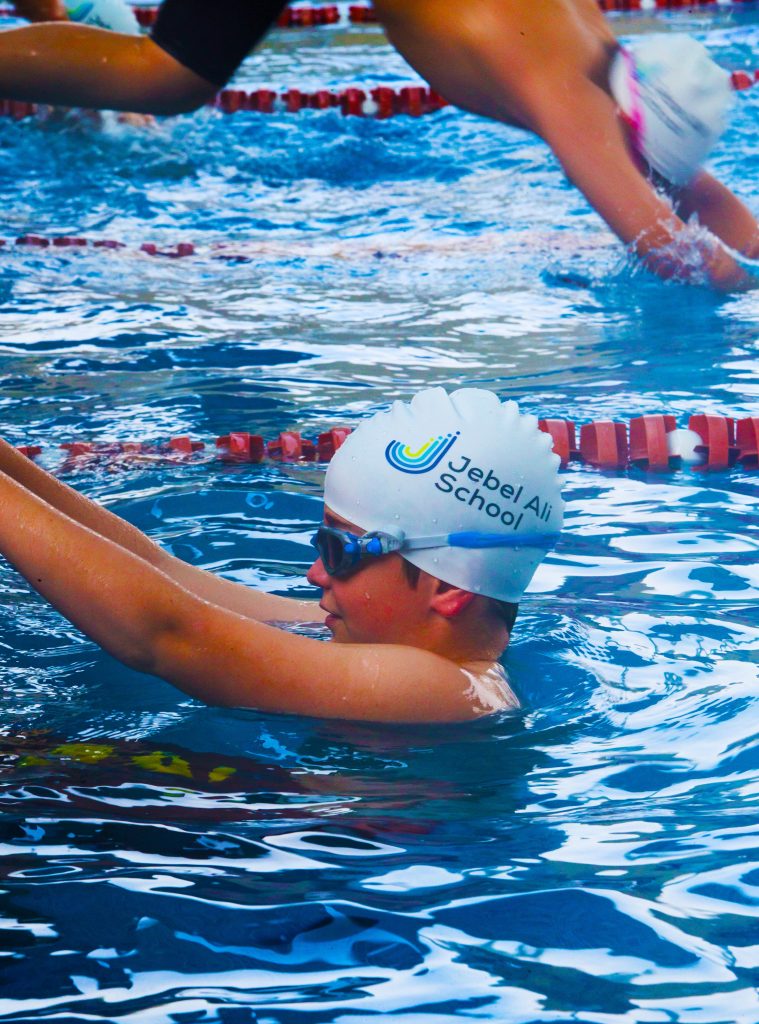 Students at the Jebel Ali School in Dubai swimming. The school has a dedicated 25M main pool and supplementary learner pool for younger children. 