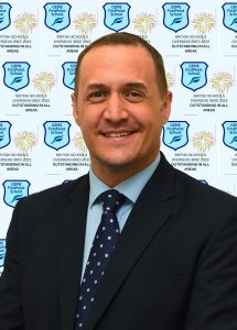 Photograph of David Wade, Principal, GEMS FirstPoint School Dubai, celebrating the school's outstanding BSO rating in 2022