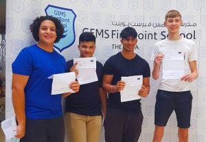 Photograph of top performing students at GEMS FirstPoint School in Dubai on GCSE Results Day 2022