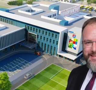 Photograph of Matthew Burfield, CEO and Principal of GEMS Founders - Al Barsha school Dubai outside his school on GCSE Results Day 2022