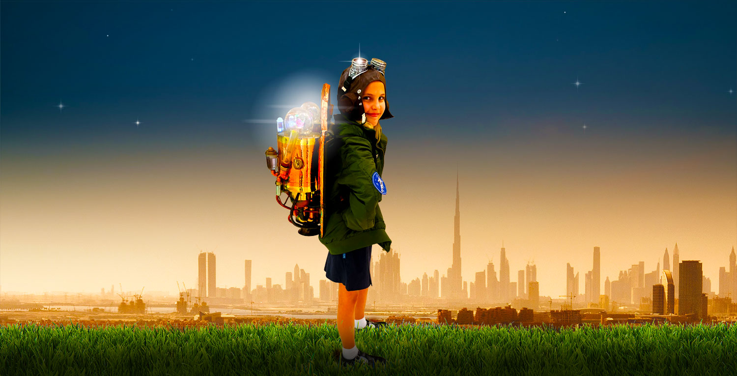 Photograph of young female student and aspiring engineer at The British School Al Khubairat in Abu Dhabi. The photograph shows her testing a Jet pack specially developed for the Top Schools Awards to showcase the importance of STEAM in education. This Award visual is for the Best On-line school and Home Learning Community in the UAE